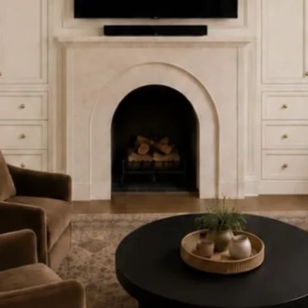 An arched plaster fireplace
