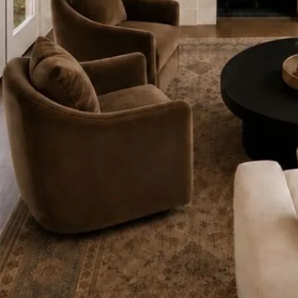 Velvet swivel chairs on a wool rug